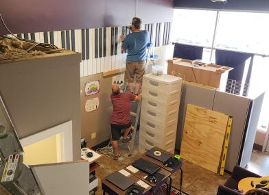 Keith & Bob install the piano mural in the music lab.