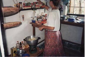 The Kitchen ~   I cooked on a one burner Coleman stove powered by petrol.  Other than the McCormick spices I brought from home, everything I ate was purchased in the local market, or the boutiques run by Lebonese or Portugese expatriates.  Since I had no refrigeration, I walked to the market every morning to purchase the food I would eat that day.  I stayed away from meat -- the butcher arrived at the market each morning in the hot sun with a wheel barrow full of various cow parts, including legs with the fur and hoofs still intact.  The butcher would wave his machete over the bloody pile to momentarily shoo the flies away and ask you what cut you were interes...